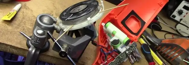 Vacuum cleaner repair parts and tools on a workbench in Marietta, GA